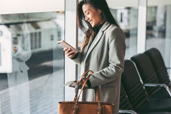 Small-Business traveler waiting for her plane at airport